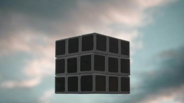 Floating black cube against cloudy sky, symbolising AI’s black-box complexity and hidden influence in decision-making.